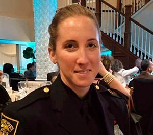 In this 2015 photo provided by the Hartford Police Department, Hartford police Officer Jill Kidik attends a ceremony in Hartford, Conn., where she was honored for saving a 1-year-old boy’s life the previous fall. (Hartford Police Department via AP)