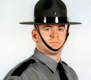This undated file photo provided by Pennsylvania State Police shows Cpl. Seth J. Kelly, a trooper shot several times Nov. 7, 2017, during a traffic stop on state Route 33 near Nazareth, Pa., in Northampton County's Plainfield Township, Pa. (Pennsylvania State Police via AP, File)