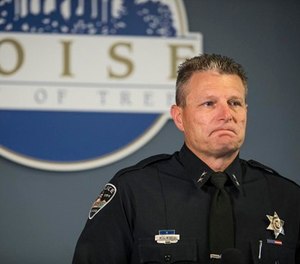 Boise Police Chief Bill Bones becomes reacts while releasing child victims' ages at a news conference for Saturday's stabbing attack that happened in Boise, at Police and Fire City Hall of Boise in Boise, Idaho, Sunday, July 1, 2018. (Meiying Wu/Idaho Statesman via AP)