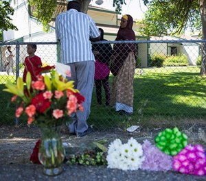 Police tape blocks off an area at a Boise, Idaho, apartment complex, Sunday, July 1, 2018, where nine people were stabbed during an attack that targeted a child's birthday party the night before. (AP Photo/Rebecca Boone)
