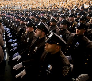 Members of New York Police Academy's July 2018 graduating class are seated during their graduation ceremony, Monday July 2, 2018, in New York.
