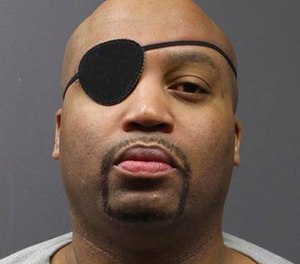In this undated photo provided by the Minnesota Department of Corrections, Edward Muhammad Johnson is shown in a mugshot. (Minnesota Department of Corrections via AP)