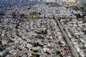 This Oct. 14, 2017 photo shows an aerial view of the devastation of the Coffey Park neighborhood in Santa Rosa, Calif. after the Tubbs Fire swept through.