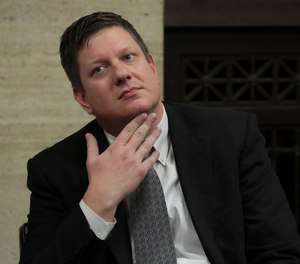 Chicago police Officer Jason Van Dyke listens while attorneys step before Judge Vincent Gaughan bench, as the jury has sent another question to Judge Gaughan, who read it aloud from the bench during deliberations in Van Dyke's trial at the Leighton Criminal Court Building, Friday, Oct. 5, 2018, in Chicago. Van Dyke is charged with first-degree murder, aggravated battery and official misconduct in the shooting of Laquan McDonald. (Antonio Perez/ Chicago Tribune via AP, Pool)