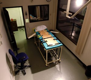 In this Nov. 20, 2008, file photo, the execution chamber at the Washington State Penitentiary is shown with the witness gallery behind glass at right, in Walla Walla, Wash. Washington state's Supreme Court has ruled that the death penalty violates its Constitution. The ruling Thursday, Oct. 11, 2018, makes Washington the latest state to do away with capital punishment. They ordered that people currently on death row have their sentences converted to life in prison. (AP Photo/Ted S. Warren, File)