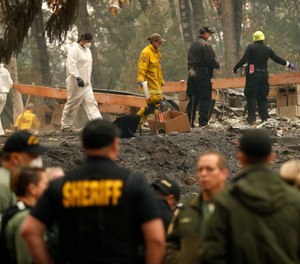 Some 52,000 people have been displaced to shelters, the homes of friends and relatives, to motels — and to a Walmart parking lot and an adjacent field in Chico, a dozen miles away from the ashes. (Photo/AP)