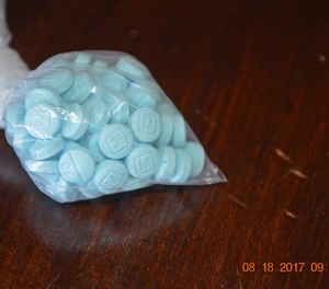 This undated photo provided by the U.S. Drug Enforcement Administration's Phoenix Division shows a closeup of the fentanyl-laced sky blue pills known on the street as 