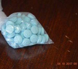 This undated photo provided by the U.S. Drug Enforcement Administration's Phoenix Division shows a closeup of the fentanyl-laced sky blue pills known on the street as