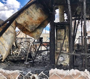 This March 9, 2019 photo provided by Cal Fire San Bernardino shows the burned out remains of a mobil home that caught fire on Saturday, March 9, 2019 in the Highland area of San Bernardino County. Southern California authorities say a man who came to the rescue of people in the burning mobile home was found dead in the wreckage. Cal Fire says arriving firefighters found four occupants had been evacuated from the mobile home but the rescuer perished. ( Cal Fire San Bernardino via AP)