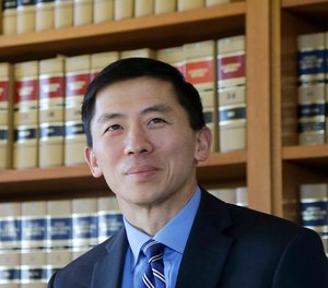 In this Jan. 13, 2017 file photo California Supreme Court Associate Justice Goodwin Liu pauses in his office in San Francisco. (AP Photo/Jeff Chiu, File)