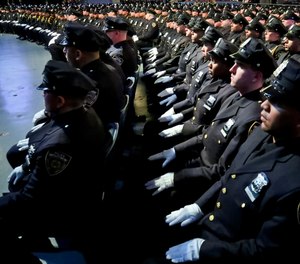 New York City Police Academy graduates sit in formation during graduation ceremony for new members of the NYPD, Thursday April 18, 2019, in New York.