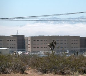 This Saturday April 20, 2019 photo shows the Adelanto Detention Center in Adelanto, Calif., a desert community northeast of Los Angeles.