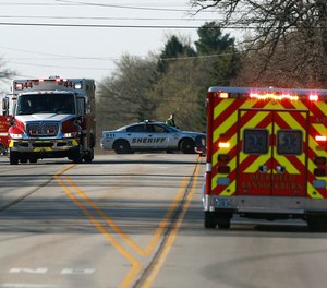 Police and emergency personnel respond to a hazardous materials situation that blocked off roads and closed schools in Beach Park, Ill., on Thursday, April 25, 2019,