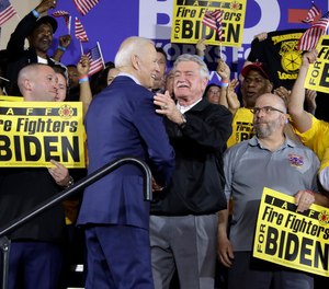 In this April 29, 2019 photo, former Vice President Joe Biden is greeted by IAFF President Harold Schaitberger during a rally in PIttsburgh. This weekend, the IAFF and Schaitberger released statements on Biden's election as president.
