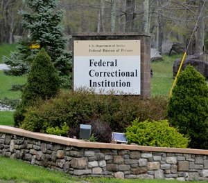 In this May 1, 2019 photo, a sign marks the entrance to the Federal Correctional Institution, Otisville in Mount Hope, N.Y. President Donald Trump's former lawyer and fixer, Michael Cohen, is due to report to the facility on Monday, May 6, 2019, to begin serving a three year sentence for tax evasion, lying to Congress and campaign finance crimes. (AP Photo/Seth Wenig)