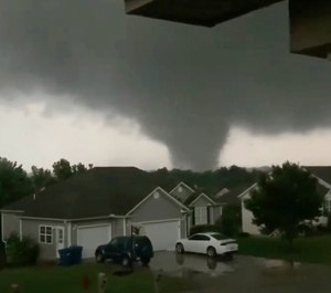 This still image taken from video provided by Chris Higgins shows a tornado, Wednesday, May 22, 2019, in Carl Junction, Mo. The tornado caused some damage in the town of Carl Junction, about 4 miles (6.44 kilometers) north of the Joplin airport. (Chris Higgins via AP)