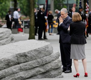 John Stewart talks with Alice Greenwald, CEO of the National September 11 Memorial & Museum, before the start of a dedication ceremony in New York, Thursday, May 30, 2019. Former New York City Mayor Michael Bloomberg says the new memorial glade at the World Trade Center site
