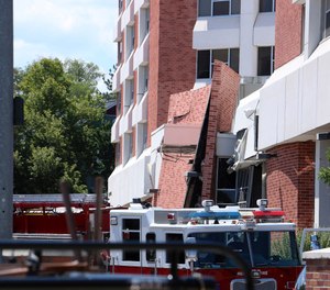 Rescue personnel respond to an explosion that damaged Argenta Hall and Nye Hall on the University of Nevada, Reno campus. A utilities explosion Friday at the University of Nevada, Reno caused the partial collapse of a dormitory building and at least minor injuries, authorities said. (Jason Bean/The Reno Gazette-Journal via AP)
