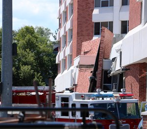 Rescue personnel respond to an explosion that damaged Argenta Hall and Nye Hall on the University of Nevada, Reno campus on July 5, 2019, in Reno, Nev. A utilities explosion caused the partial collapse of a dormitory building and at least minor injuries, authorities said. (Jason Bean/The Reno Gazette-Journal via AP)