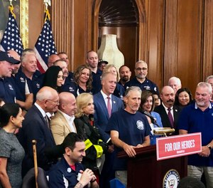 Entertainer and activist Jon Stewart speaks at a news conference on behalf of 9/11 victims and families at the Capitol in Washington. (AP Photo/Matthew Daly)