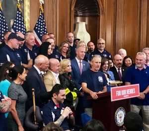 Entertainer and activist Jon Stewart, speaks at a news conference on behalf of 9/11 victims and families, Friday, July 12, 2019, at the Capitol in Washington. Stewart is hosting the event, “NYC Still Rising After 20 Years: A Comedy Celebration,” to benefit 9/11 charities.