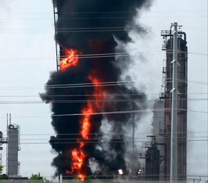 Flames and smoke emanate from an Exxon Mobil facility in Baytown, Texas.