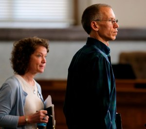 The family of a teenager who died trapped in a vehicle despite making two 911 pleas for help has filed a wrongful death lawsuit against the city of Cincinnati. (Photo/Kareem Elgazzar, The Cincinnati Enquirer via AP)