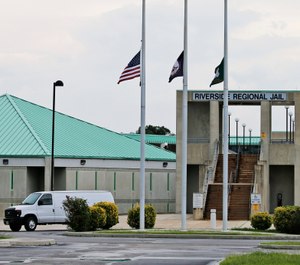 This Aug. 7, 2018, photo shows the entrance to the Riverside Regional Jail in Prince George, Va. The jail was the site of a suicide by inmate Alex Wesley Tripp who died shortly after his arrival at the jail. (AP Photo/Steve Helber)