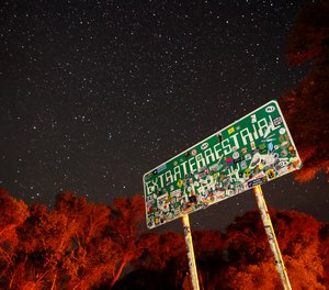In this July 22, 2019 file photo, a sign advertises state route 375 as the Extraterrestrial Highway, in Crystal Springs, Nev., on the way to Nevada Test and Training Range near Area 51.