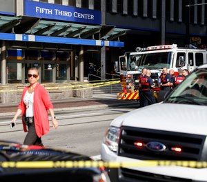 In this Sept. 6, 2018 file photo emergency personnel and police respond to a reported active shooter situation near Fountain Square in Cincinnati.