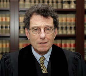 Judge Dan Polster presides over most of the 2,000 lawsuits filed by state, local and tribal governments. (Photo/AP, Tony Dejak)