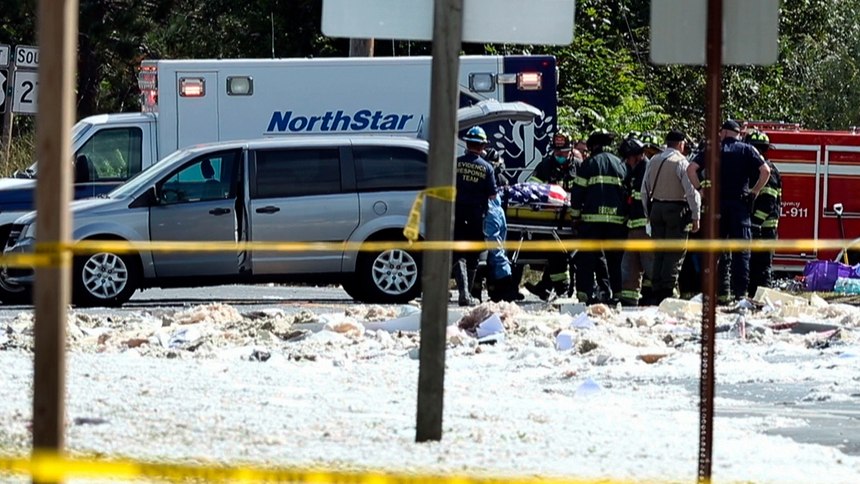 In an image from video, a flag-draped body is moved to a coroner's vehicle at the scene of an explosion, Monday, Sept. 16, 2019, in Farmington, Maine. Officials say a town's fire chief is among the injured in a propane explosion that killed a firefighter. State public safety spokesman Steve McCausland said after Monday morning's explosion at a nonprofit center in Farmington that multiple people remain hospitalized. 
