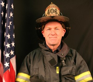 In this October 2004 photo provided by the Farmington Fire Rescue Department, Capt. Michael Bell of the Farmington, Maine, Fire Department, poses for a department photo. Bell, 68, was killed in a propane blast on Monday, Sept. 16, 2019, that flattened a building and damaged 11 nearby mobile homes.