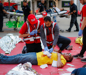 First responders stage a simulated triage outside Great American Ball Park during a mass casualty training exercise, Thursday, Sept. 19, 2019, in Cincinnati.