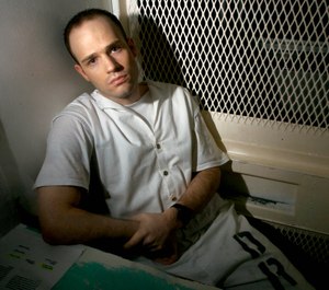 In this Dec. 3, 2003, file photo, death row inmate Randy Halprin, then 26, sits in a visitation cell at the Polunsky Unit in Livingston, Texas. (AP Photo/Brett Coomer, File)