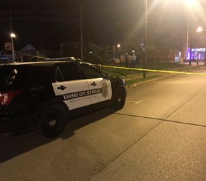 In this image from 41 KSHB, Kansas City Action News police work the scene of a shooting outside a Kansas City, Kansas bar Sunday, Oct. 6, 2019. (41 KSHB Kansas City Action News via AP)
