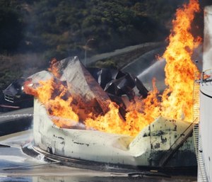 A tank burns as fire breaks out at a refinery in Crockett, Calif. (Anda Chu/San Jose Mercury News via AP)