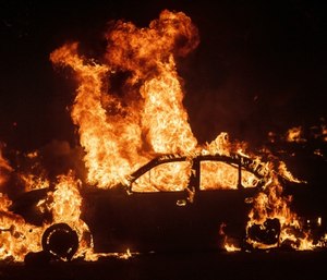 Flames from the Kincade Fire consume a car in the Jimtown community of unincorporated Sonoma County, Calif. (AP Photo/Noah Berger)