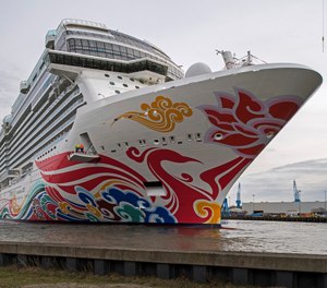 In this March 4, 2017, file photo, Norwegian's cruise liner "Joy" floats out of the Meyer shipyard's building dock in Papenburg, northern Germany. Authorities say over a dozen people aboard the cruise ship reported flu-like illnesses as they reached a Southern California port. (Photo/Ingo Wagner, dpa via AP, File)