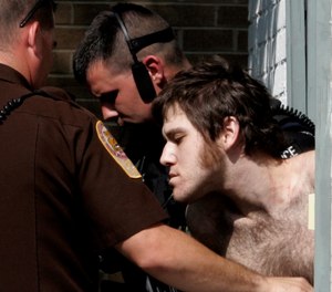 In this Aug. 21, 2006, file photo, William Morva is escorted out of the Montgomery County magistrates office after his capture in Christiansburg, Va. Morva was executed in 2017 for the murder of Cpl. Eric Sutphin. (AP Photo/Steve Helber, File)