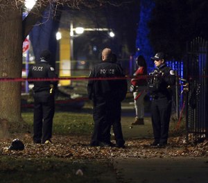 Chicago police guard a crime scene in the 5700 block of S. May Street in Chicago after several people were shot there on Sunday, Dec. 22, 2019. (Photo/Terrence Antonio James, Chicago Tribune via AP)