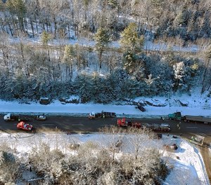 In this aerial photo from a Maine Forest Service helicopter released by the Maine State Police, emergency personnel work at the scene of a multi-car accident on Interstate 95 Tuesday, Jan. 7, 2020, in Carmel, Maine