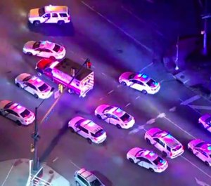 In this image made from video provided by NBC10 Philadelphia, police officers try to surround a stolen ambulance in an attempt to stop it in Philadelphia on Friday, Feb. 28, 2020. The ambulance fled from the police in the scene but was later captured. A man stole the ambulance and tried to run over an officer who shot him three times, leading to a low-speed chase through Philadelphia that lasted more than an hour Friday night, authorities said. (Photo/NBC10 Philadelphia via AP)