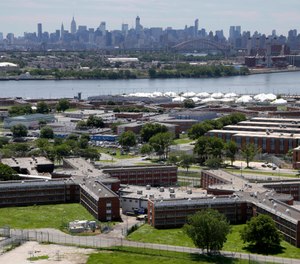 More than three dozens of people have tested positive for coronavirus in New York City jails, including at the Rikers Island jail complex, the board that oversees the city's jail system said Saturday, March 21, 2020. (AP Photo/Seth Wenig, File)