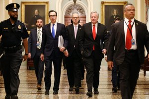 Treasury Secretary Steven Mnuchin, left, accompanied by White House Legislative Affairs Director Eric Ueland and acting White House chief of staff Mark Meadows, walks to the offices of Senate Majority Leader Mitch McConnell of Ky. on Capitol Hill in Washington, Tuesday, March 24, 2020. Image: AP Photo/Patrick Semansky
