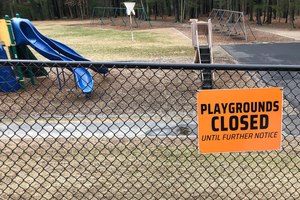 This Friday, March 20, 2020 file photo shows a closed sign near an entrance to a playground at an elementary school in Walpole, Mass., amid the COVID-19 coronavirus outbreak. Image: AP Photo/Steven Senne