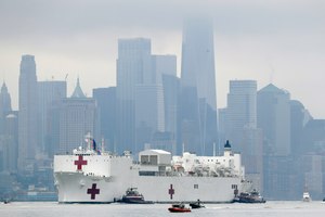 The Navy hospital ship USNS Comfort passes lower Manhattan on its way to docking in New York, Monday, March 30, 2020. Image: AP Photo/Seth Wenig
