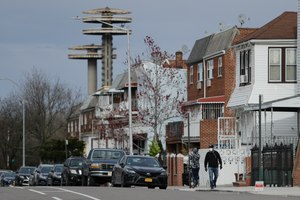 Pedestrians walk near Flushing Meadows Corona park Thursday, April 2, 2020, in the Corona section of the Queens borough of New York. NYC is one of several cities seeing disproportionate spikes in COVID-19 cases among African-American communities. Image: AP Photo/Frank Franklin II