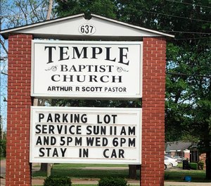 This image provided by Alliance Defending Freedom shows the sign for parking lot church services outside of Temple Baptist Church in Greenville, Miss., on April 9, 2020.
