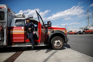 FDNY paramedic Elizabeth Bonilla prepared her ambulance for a double shift at EMS Station 3 on April 15, 2020, in the Bronx. During the height of the pandemic in March and April 2020, about 25% of the department was on medical leave for EMS.